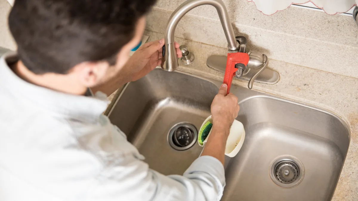 Kitchen sink and garbage disposal area being serviced